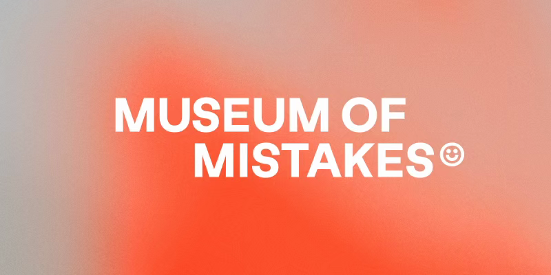 Museum of Mistakes logo in white on a blurred red and orange gradient